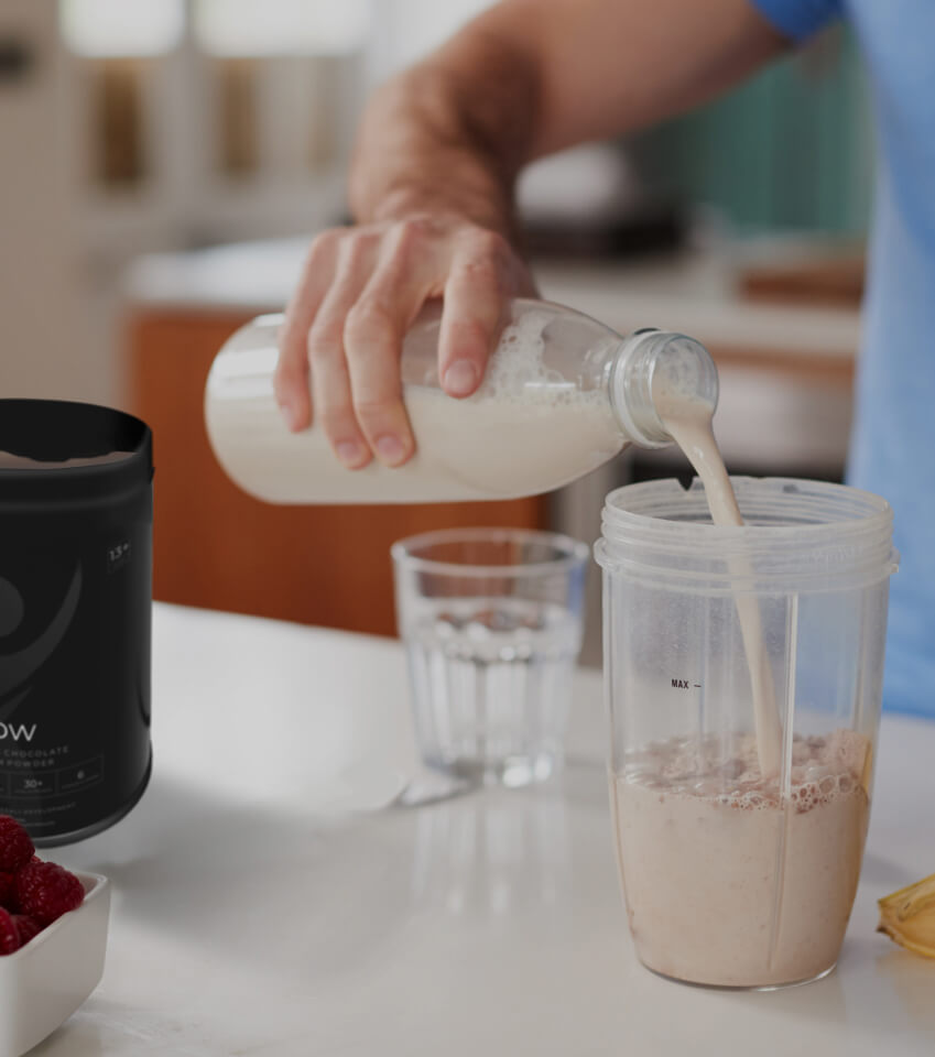 Pouring protein shake into a glass
